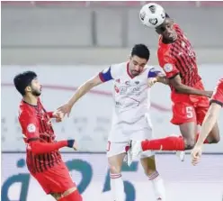  ??  ?? ↑
Al Jazira and Sharjah players in action during their AGL match on Friday.