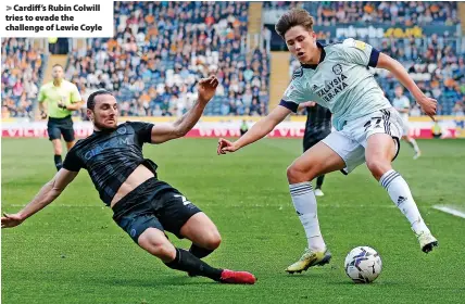  ?? ?? > Cardiff’s Rubin Colwill tries to evade the challenge of Lewie Coyle