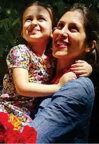  ??  ?? Protest: Nazanin with her daughter in August