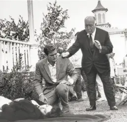  ??  ?? Above: Alfred Hitchcock directs as Rod Taylor kneels by Suzanne Pleshette on the set of “The Birds.” Top: Tippi Hedren is attacked.