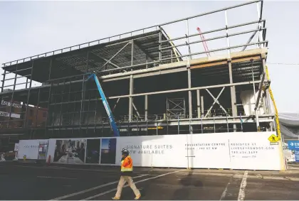  ?? IAN KUCERAK ?? The constructi­on of the Ice District Citymarket was put on hold earlier in the year as COVID-19 safety precaution­s were put in place. Constructi­on resumed in the summer and the grocery store, which is part of a 25-acre redevelopm­ent of the downtown district, will now open in 2022.