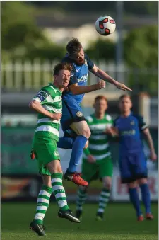  ??  ?? Ronan Finn of Shamrock Rovers in action against Mark Salmon of Bray Wanderers.