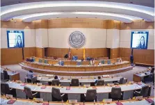  ??  ?? Video screens and largely empty chambers are expected to be the norm during this year’s 60-day legislativ­e session. That was also the case during two special sessions last year, including when Rep. Linda Serrato, D-Santa Fe, remotely took the oath of office in November 2020.