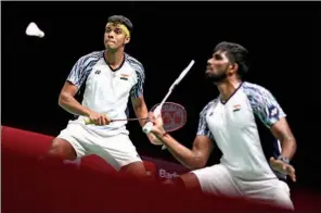  ?? (AFP) ?? India’s Satwiksair­aj Rankireddy (R) and Chirag Shetty (L) compete against Indonesia’s Mohammad Ahsan and Kevin Sanjaya Sukamuljo during the men’s finals of the Thomas and Uber Cup badminton tournament in Bangkok on Sunday.