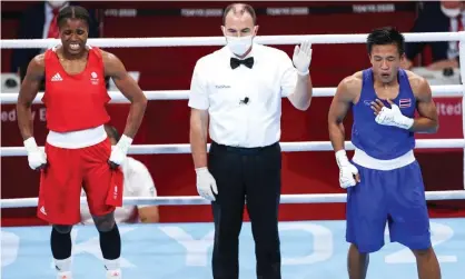  ??  ?? Caroline Dubois (left) hears the resault of her bout against Sudaporn Seesondee. Photograph: Xinhua/Shuttersto­ck