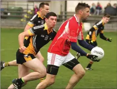  ??  ?? John O’Loughlin (Monageer-Boolavogue) is pursued by Billy Conroy (Réalt na Mara) in Sunday’s JBFC semi-final in Bellefield.