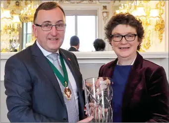  ??  ?? John Gaynor, Chair of ACCA Ireland presents Etain Doyle FCCA Senior Executive Coach and Mentor and former Chair of ACCA Ireland with Accountant of the Year.