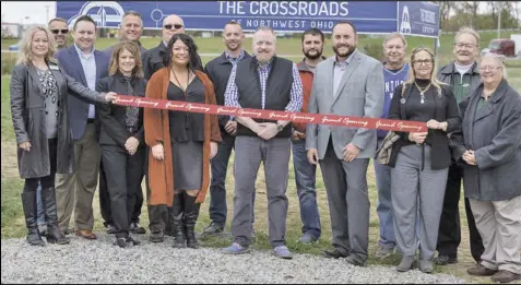  ?? ?? Crossroad project partners gathered for a ribbon cutting in October to kick off the next phase of
developmen­t for the Cridersvil­le mixed-use community