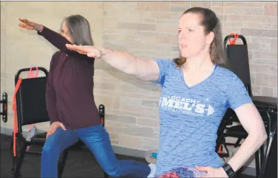  ?? Leslie Hutchison/Hearst Connecticu­t Media ?? Melanie Joseph, or “Coach Mel” as her students know her, right, teaches a “SilverSnea­ker” exercise class at her Harwinton studio.