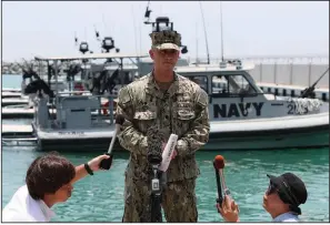  ?? AP/KAMRAN JEBREILI ?? Navy Cmdr. Sean Kido speaks Wednesday at a base near Fujairah, United Arab Emirates. He said damage to the Kokua Courageous tanker was “consistent with a limpet mine attack” and was “not consistent with an external flying object hitting the ship,” as the ship’s owner has claimed.