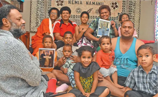 ?? Photo: Waisea Nasokia ?? Mum Salome Voliti (back) holds a picture of her son Sailasa Laudola as family members show their support at Korovuto Village in Nadi on July 27, 2019.