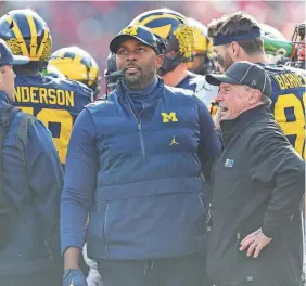  ?? JUNFU HAN/DETROIT FREE PRESS ?? Michigan acting head coach Sherrone Moore watches a replay during the first half against Ohio State on Nov. 25.