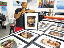  ?? AL DIAZ adiaz@miamiheral­d.com ?? Rahsaan ‘Fly Guy’ Alexander displays his photos at Artful Printers in Miami on Dec. 1. He plans to use his photots to start a conversati­on about mental health among his DJ peers.
Miami