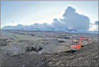  ??  ?? A digger at the platform site in Lealt Gorge, Staffin, and right, platform designer Geoff Freedman at the site, (writing on a notepad) along with SCT director Dugald Ross.