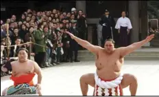  ?? ASSOCIATED PRESS ?? Accompanie­d by a sword-bearer, grand champion Akebono performs the ring-entrance ritual on Jan. 8, 1997, during the annual New Year’s dedication at Meiji Shrine in Tokyo.