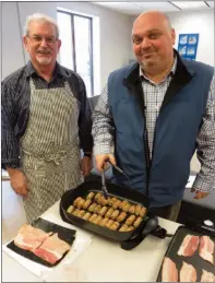  ??  ?? Sam Wells and Dave Goulding prepare a special lunch for the team at Coldwell Banker Pro Co. It will be served in the Cafe-Style general area of the new premises. The occasion was a belated Valentines Day brunch. Contacts: samwells@yahoo.ca / 685-0902....