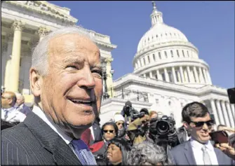  ?? AP ?? Joe Biden greets the crowd on Capitol Hill in Washington on Wednesday, following an event marking seven years since Barack Obama signed the Affordable Care Act into law. “I was fairly confident that if I was the Democratic Party nominee [in 2016], I...