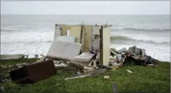  ?? CARLOS GIUSTI — THE ASSOCIATED PRESS ?? A completely ruined house is seen in El Negro community a day after the impact of Hurricane Maria, in Puerto Rico, Thursday.