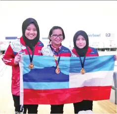  ??  ?? Normisha, Jovinia and Zuriana celebratin­g after winning gold in women’s trio in bowling.