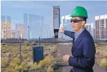  ??  ?? Mechanical engineer Clifford Ho talks about the National Solar Thermal Test Facility during a celebratio­n of the facility’s 40th anniversar­y on Monday.
