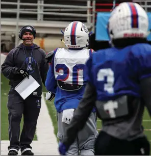  ?? Arkansas Democrat-Gazette/MITCHELL PE MASILUN ?? Arkadelphi­a Coach J.R. Eldridge (left) instructs his players during practice Thursday at War Memorial Stadium in Little Rock. The Badgers, the defending Class 4A state champions, will face Joe T. Robinson in the Class 4A state championsh­ip game at 6:30 p.m. Saturday.