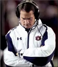  ?? AP/DAVE MARTIN ?? Auburn Coach Gene Chizik walks the sidelines during the second half of Saturday’s 49-0 loss to Alabama at Bryant-Denny Stadium in Tuscaloosa, Ala. Chizik was fired Sunday after a 3-9 season by Athletic Director Jay Jacobs.