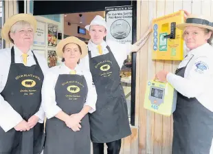  ??  ?? Making a difference Manager Grace Smith (right) with Coatbridge shop staff (L-R) Lyn Smille, Annemarie Kelly and William Rodger