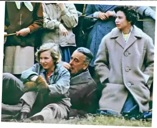  ??  ?? Royal repose: Kneeling on a picnic rug at the Badminton Horse Trials in 1962 is about as informal as the Queen gets in public. Engrossed in the action, she is accompanie­d by 11-year-old Princess Anne and a relaxed Earl Mountbatte­n of Burma.