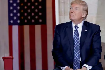  ?? AP ?? President Donald Trump takes his seat after speaking on Capitol Hill in Washington on Tuesday during the United States Holocaust Memorial Museum's National Days of Remembranc­e ceremony —