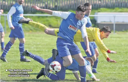  ??  ?? The Nefyn defence holds off this Holyhead attack