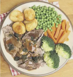  ??  ?? 0 Above, a traditiona­l roast lamb dinner with roast potatoes, vegetables, gravy and mint sauce; below, from left, Craig Millar; Rachel Morgan and Emily Cuddeford from Twelve Triangles Bakery; Fred Berkmiller of L’escargot Bleu
Leg of lamb roasted on top of Greek gigantes (or extra large butter beans) Serves 6-8 people