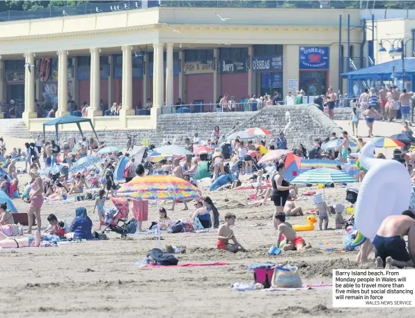  ?? WALES NEWS SERVICE ?? Barry Island beach. From Monday people in Wales will be able to travel more than five miles but social distancing will remain in force