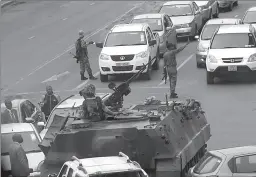  ?? HARARE
-AFP ?? Military vehicles and soldiers patrol the streets in Zimbabwe.