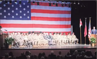  ?? / Kevin Myrick ?? Members of the 108th Cavalry Apache Troop stationed out of the Georgia National Guard Armory in Cedartown listen to State Rep. Trey Kelley address the company and their family and friends during a Nov. 26 sendoff ceremony.