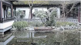  ??  ?? Contrastin­g textures are carefully arranged to represent the theme of yin and yang, nature’s harmony in the garden. Gentle foliage caresses the rocks along the shoreline of the garden’s lake, soft green moss blankets the roof tiles. The large Lake Tai...