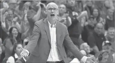  ?? Jamie Squire/Getty Images North America/TNS/Tribune Content ?? Connecticu­t head coach Dan Hurley works the sidelines against Kansas at Allen Fieldhouse on Dec. 1, 2023, in Lawrence, Kansas.