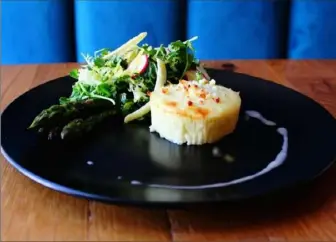  ?? Spoon Restaurant ?? A variation of the souffle at Spoon in East Liberty, this one with goat cheese, baby artichokes, asparagus and arugula, for $ 12 on the appetizer portion of the menu.