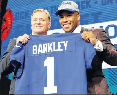  ?? AP PHOTO ?? Penn State’s Saquon Barkley, right, poses with NFL commission­er Roger Goodell after being selected by the New York Giants during the first round of the Thursday’s draft.