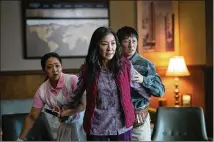  ?? ALLYSON RIGGS/A24 FILMS VIA AP ?? Stephanie Hsu (from left), Michelle Yeoh and Ke Huy Quan star in “Everything Everywhere All at Once.”