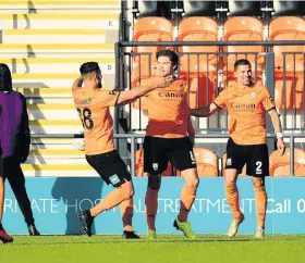  ??  ?? Barnet players celebrate Craig Robson’s first-half goal against Rovers