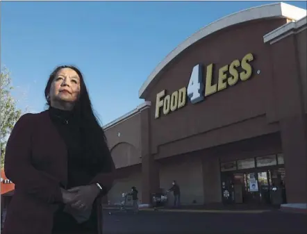  ?? Genaro Molina Los Angeles Times ?? NORMA LEIVA, a warehouse manager for Food 4 Less, has worked throughout the pandemic and hasn’t contracted the coronaviru­s, though some of her co-workers in Panorama City became infected after Thanksgivi­ng. She prays before she goes to work.