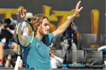  ?? AP PHOTO/MARK SCHIEFELBE­IN ?? Stefanos Tsitsipas celebrates after defeating Roberto Bautista Agut in their quarterfin­al match at the Australian Open on Tuesday in Melbourne. Tsitsipas won the match 7-5, 4-6, 6-4, 7-6 (2).