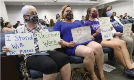  ??  ?? Vaccine advocates wait for the start of a state legislativ­e committee meeting, on 21 July in Nashville, Tennessee, after the firing of Dr Michelle Fiscus. Photograph: John Amis/AP