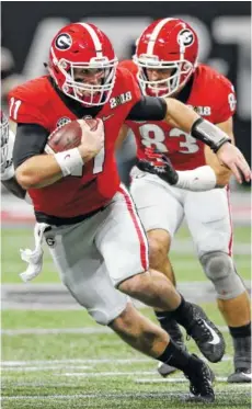  ??  ?? Georgia quarterbac­k Jake Fromm runs the ball during the first half against Alabama on Monday.