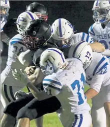  ?? JULIA MALAKIE / LOWELL SUN FILE ?? Pelham defenders surround Campbell’s Ayden Lessard during an Oct. 2 game.