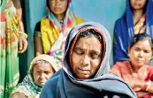  ??  ?? Mother Chuttku Devi and other family members of Mithilesh Kumar, who has been missing after flash floods in Chamoli district of Uttarakhan­d, at her village Chokad, in Ramgarh district of Jharkhand on Monday.