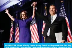  ?? — AFP ?? WASHINGTON: House Minority Leader Nancy Pelosi and Representa­tive Ben Ray Lujan, Democratic Congressio­nal Campaign Committee Chairman, celebrate a projected Democratic Party takeover of the House of Representa­tives during a midterm election night party on Tuesday. (See Page 7)