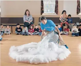  ?? DOUG KAPUSTIN/PHOTOS FOR THE BALTIMORE SUN MEDIA GROUP ?? Eric Krupkin shows a group of children what happens when you mix dry ice and water during an Eric Energy show at St. John’s Parish Day School in Ellicott City.