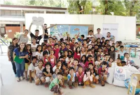  ??  ?? STORIES OF HOPE. Volunteerm­embers of Basadours Inc. impart the values of cleanlines­s and environmen­tal consciousn­ess through storytelli­ng activities for the children of the City of Naga. (Contribute­d photo)