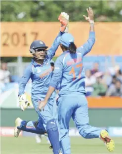  ??  ?? DERBY: India’s Sushma Verma celebrates with India’s Harmanpree­t Kaur after taking a catch to dismiss Pakistan’s Bibi Nahida during the ICC Women’s World Cup 2017 match between India and Pakistan at County Ground in Derby, England, Sunday. —AP